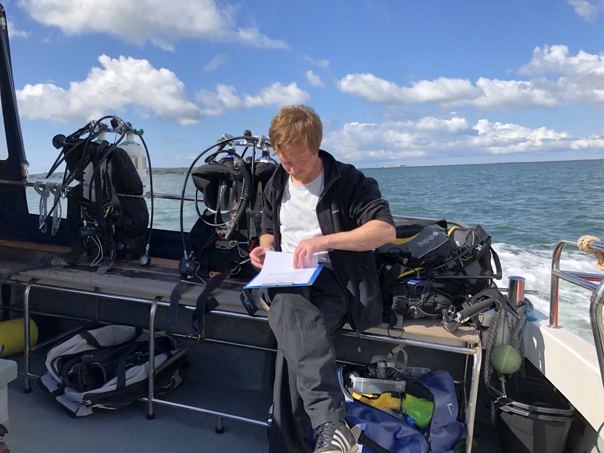 Bouldnor Cliff scuba diving volunteer filling out form